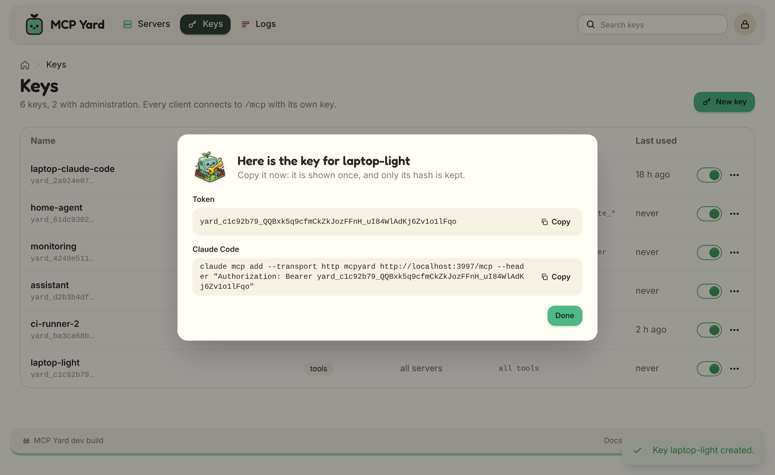 A freshly created key with its token and the Claude Code command